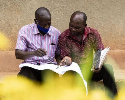 A member of the Volunteer Health Team meets with a caregiver