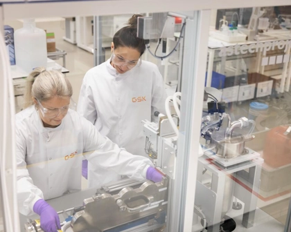 two respiratory scientists using NGI machine