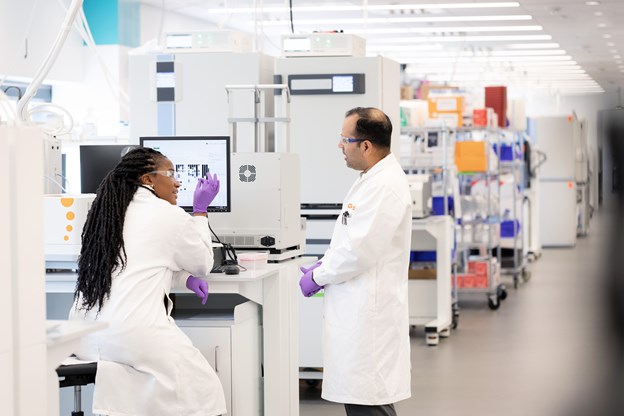 Two scientists talking in Upper Providence Lab