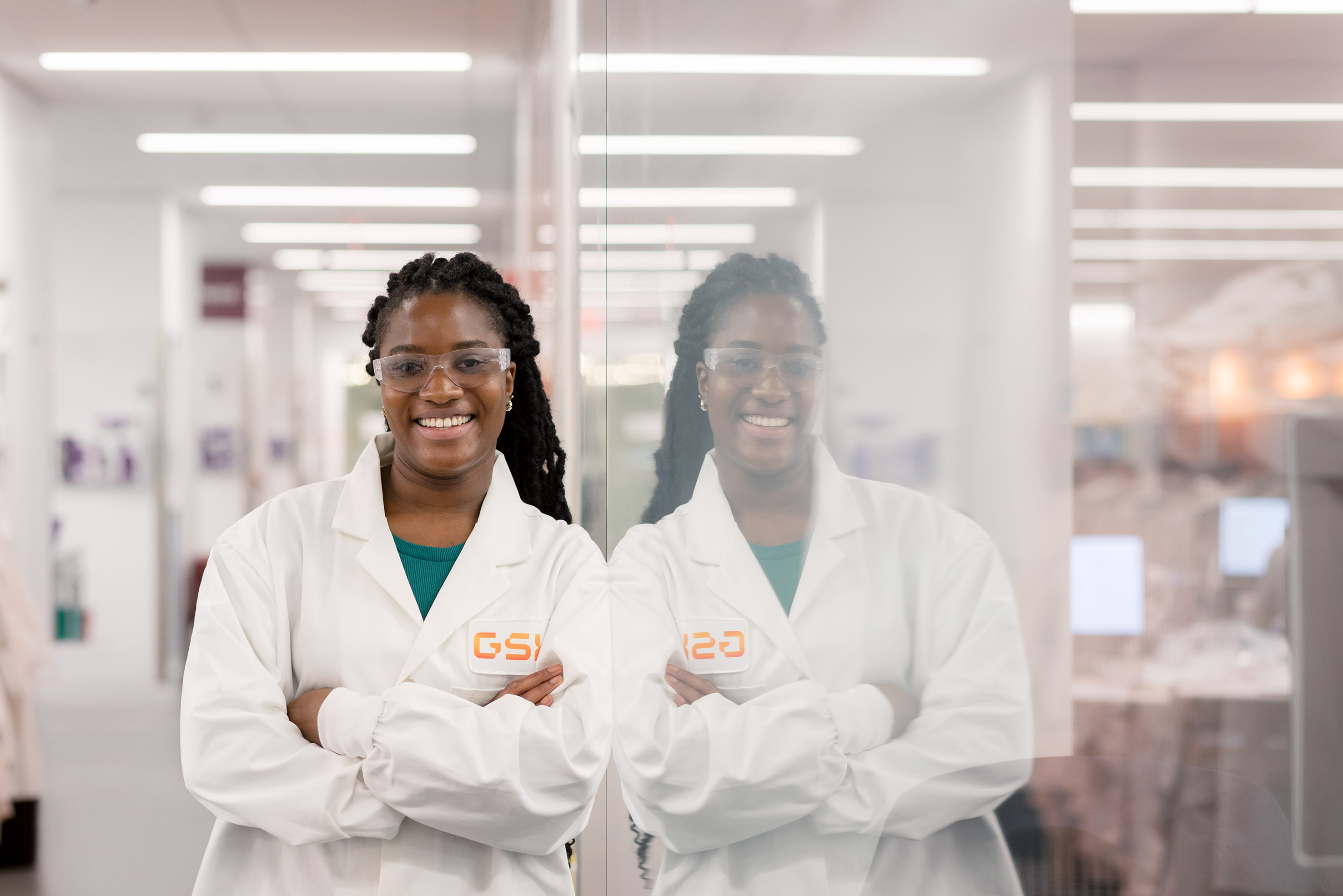 Young women scientist in a GSK lab coat