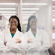 Young women scientist in a GSK lab coat