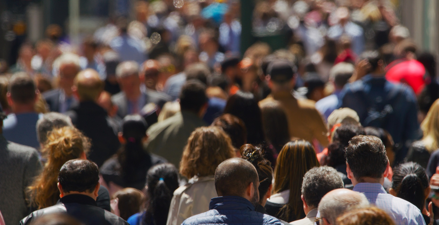 Crowd of people walking in a street