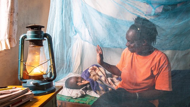 Mother, Child, Mosquito Net In Bedroom in Kenya