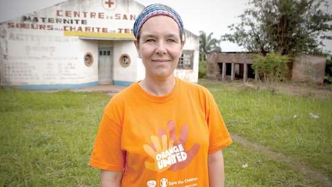 Nadine Pelletier GSK PULSE volunteer Africa standing outside of a hosptial 