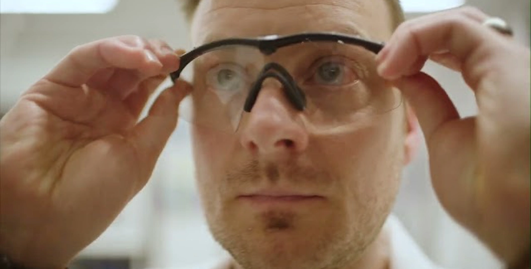 close up of man wearing safety glasses