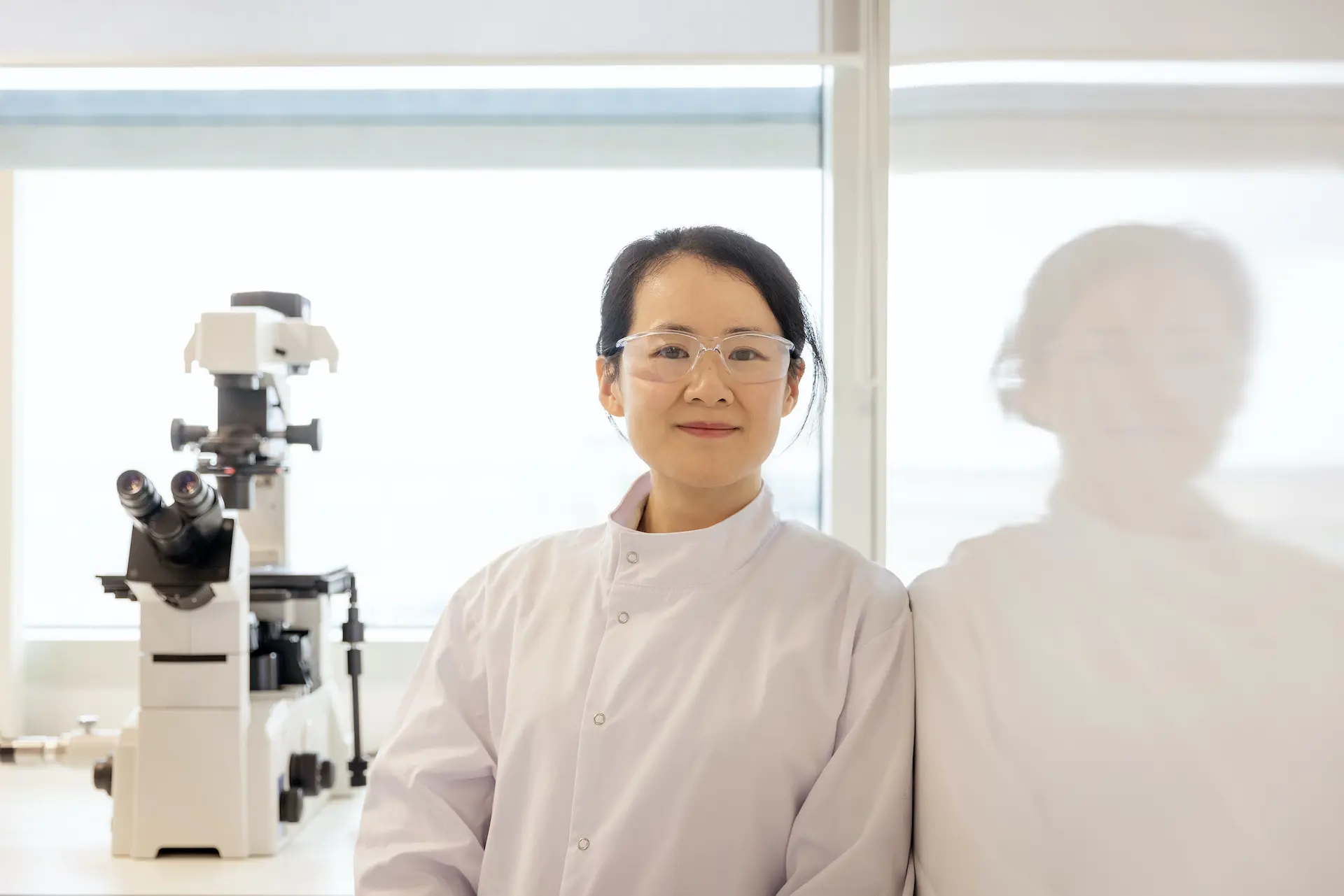 R&D scientist in high throughput screening lab.