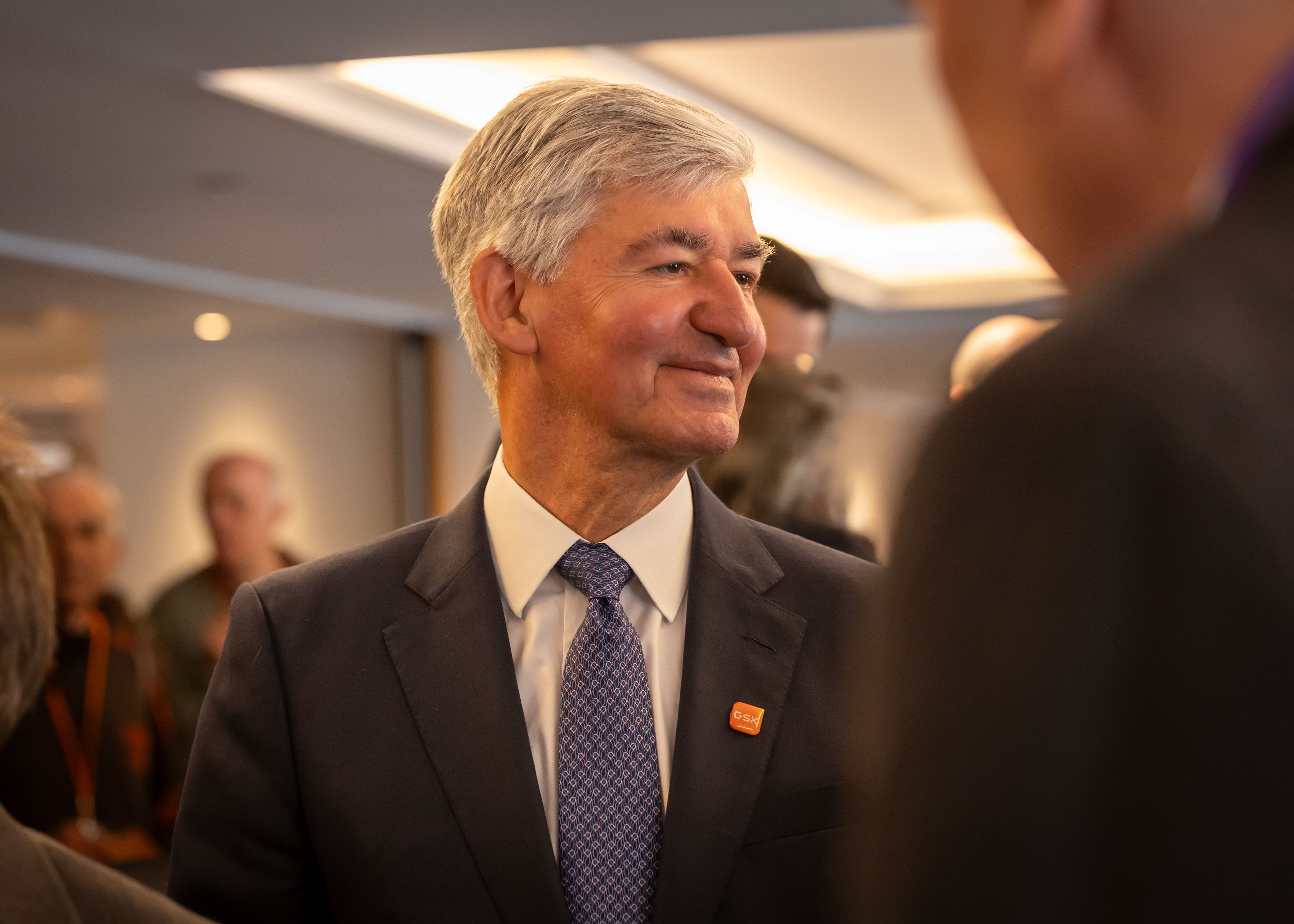 GSK Chair, Jon Symonds  listens to shareholder speak at AGM