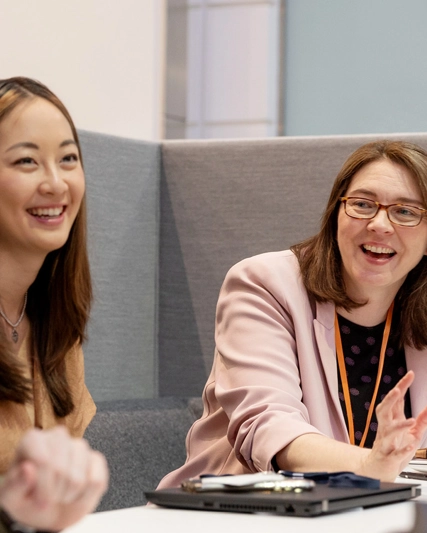Group of employees laughing