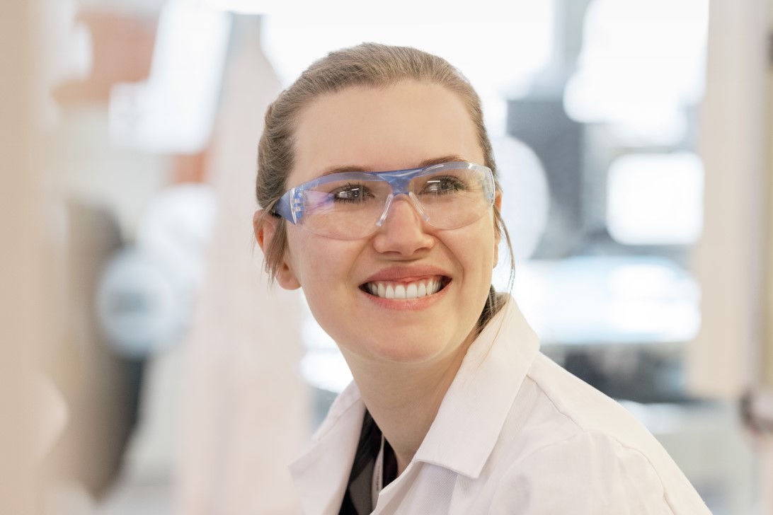 Lab worker smiling