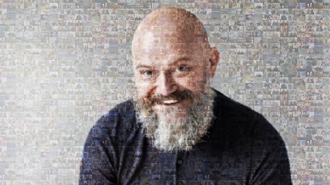A mosaic of a man smiling 