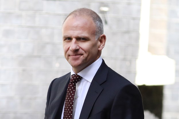 Man in a suit smiling
