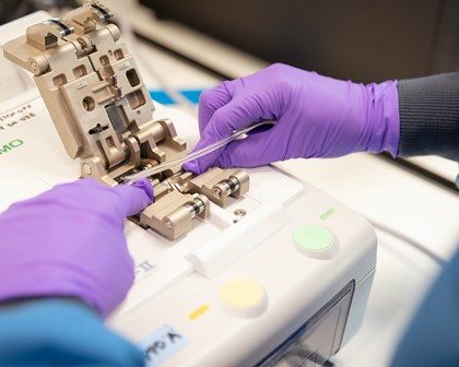 R&D scientist setting up Prodigy machine whilst working in cell and gene therapy.