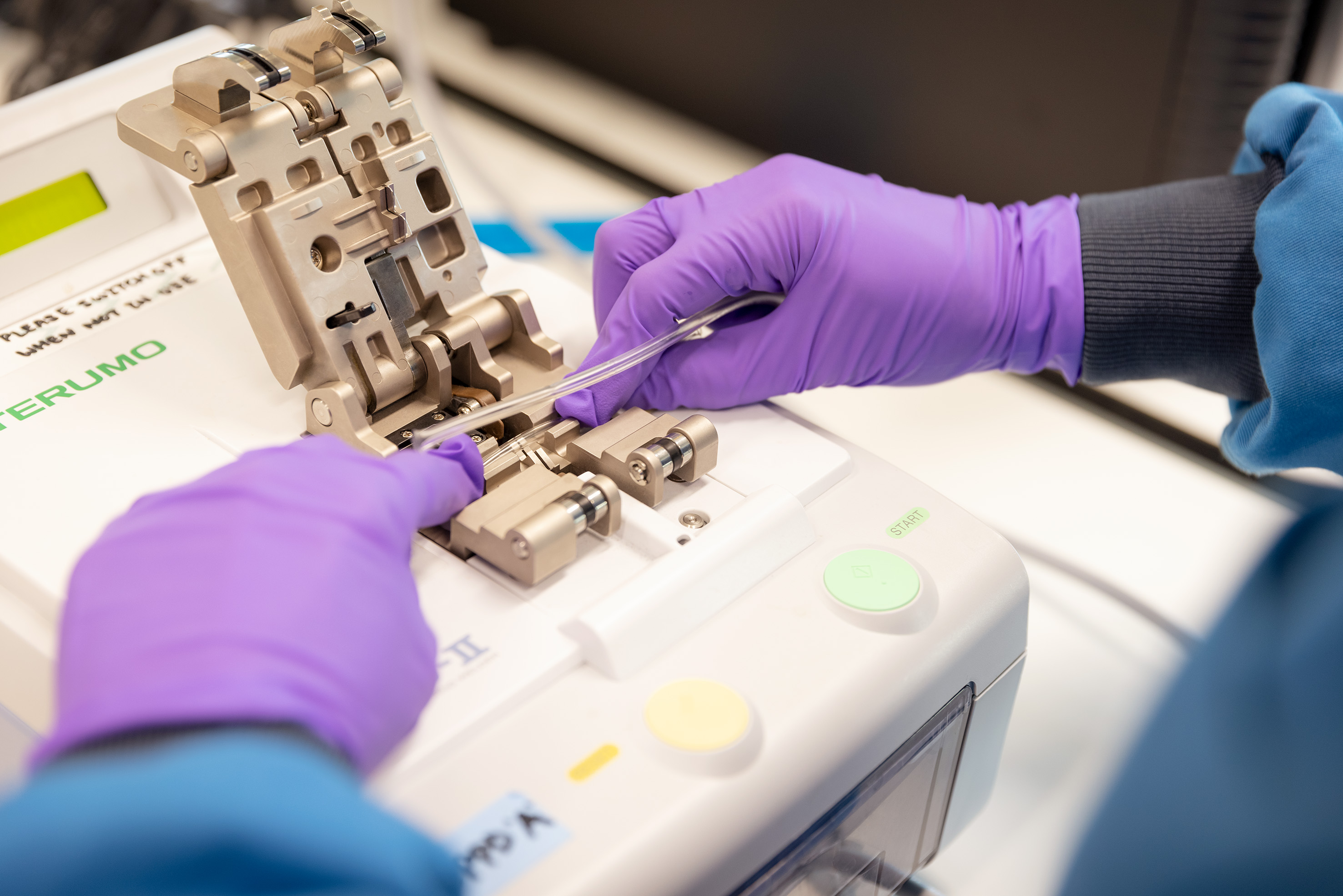 Person setting up gene therapy machine