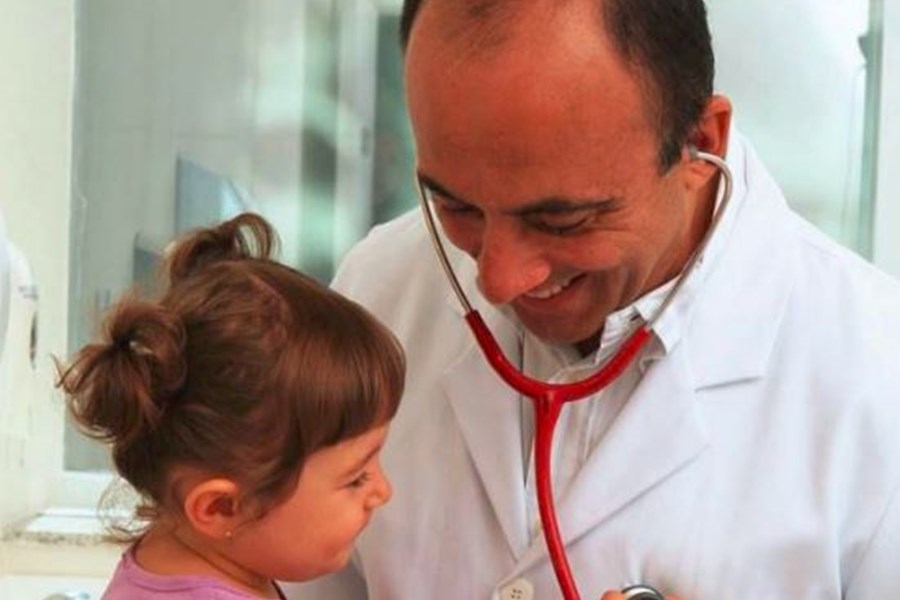 Doctor attending to child