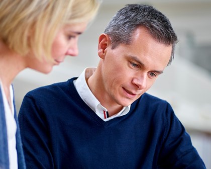 Man and woman using a Tablet together