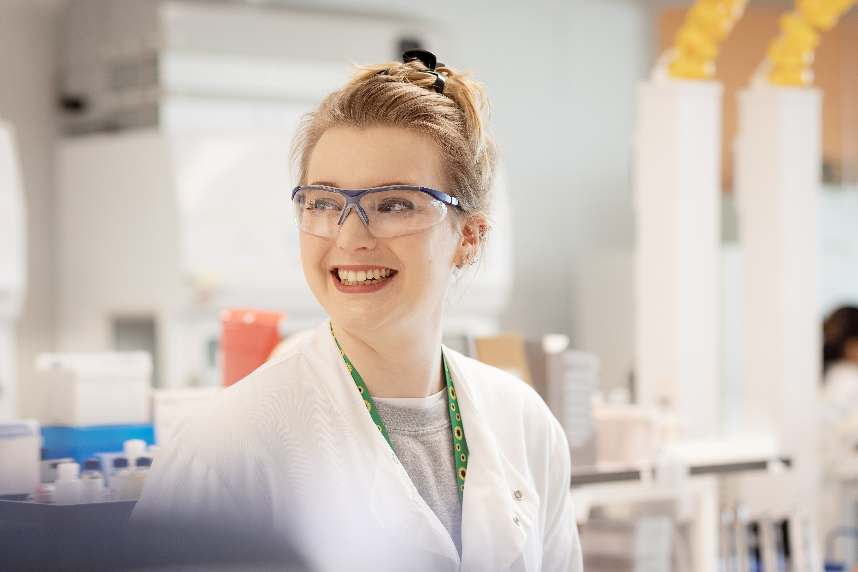 Lab worker smiling