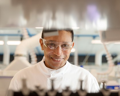 Lab worker smiling