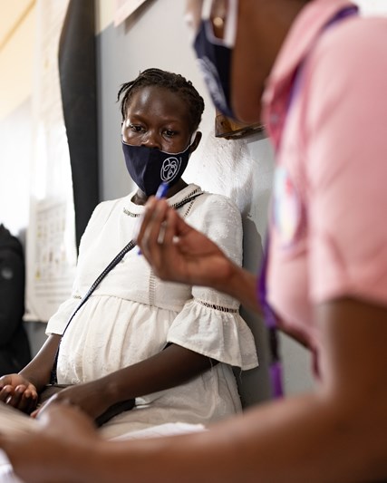 Pregnant woman talking to doctor