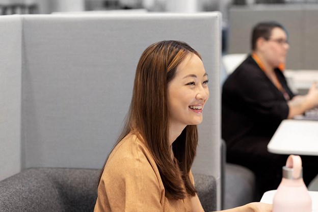 Woman at desk smiling 