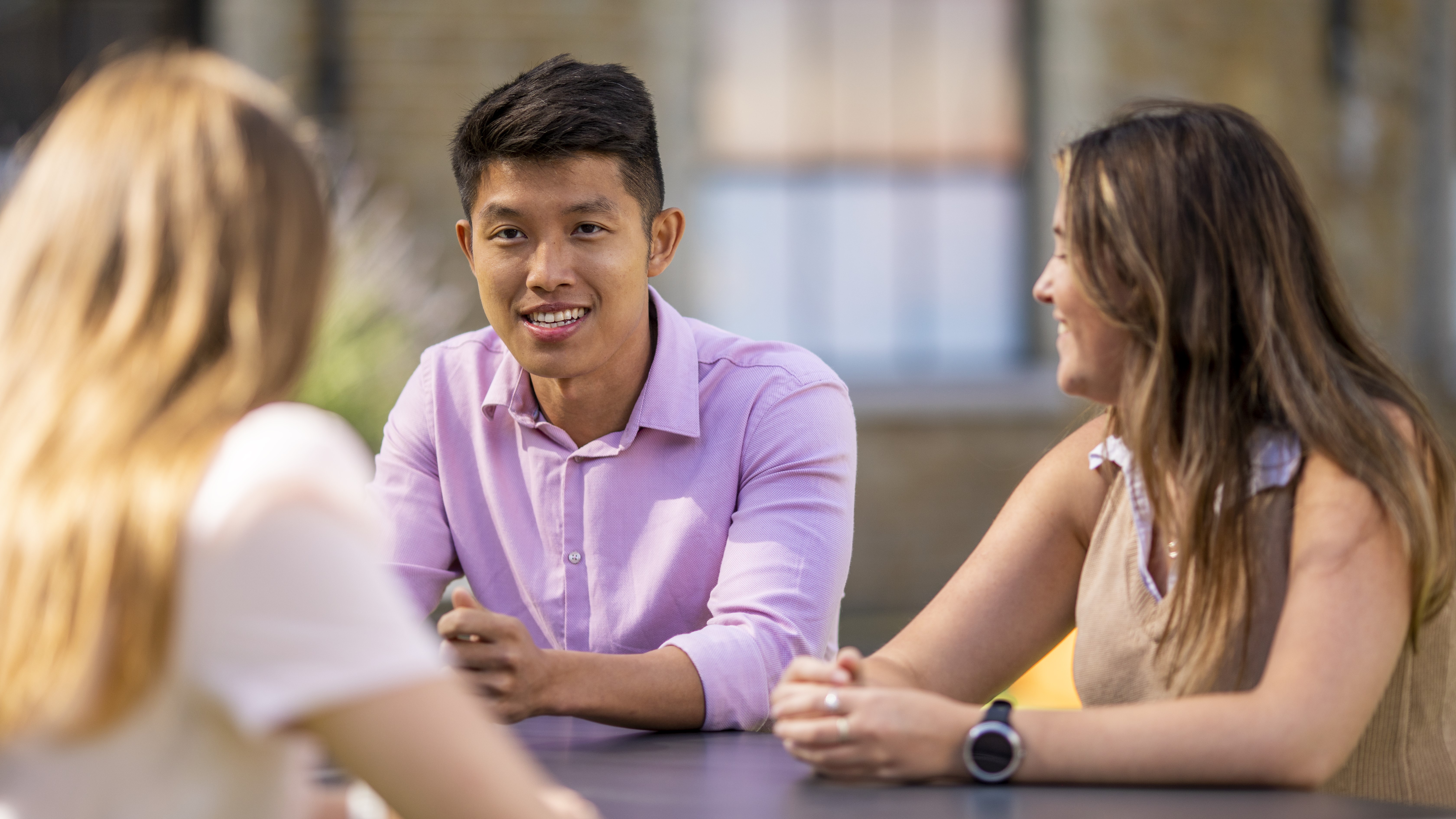 team members talking outside