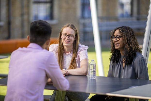 Early Talent team members talking outside