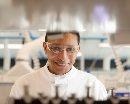 Scientist smiling in a lab