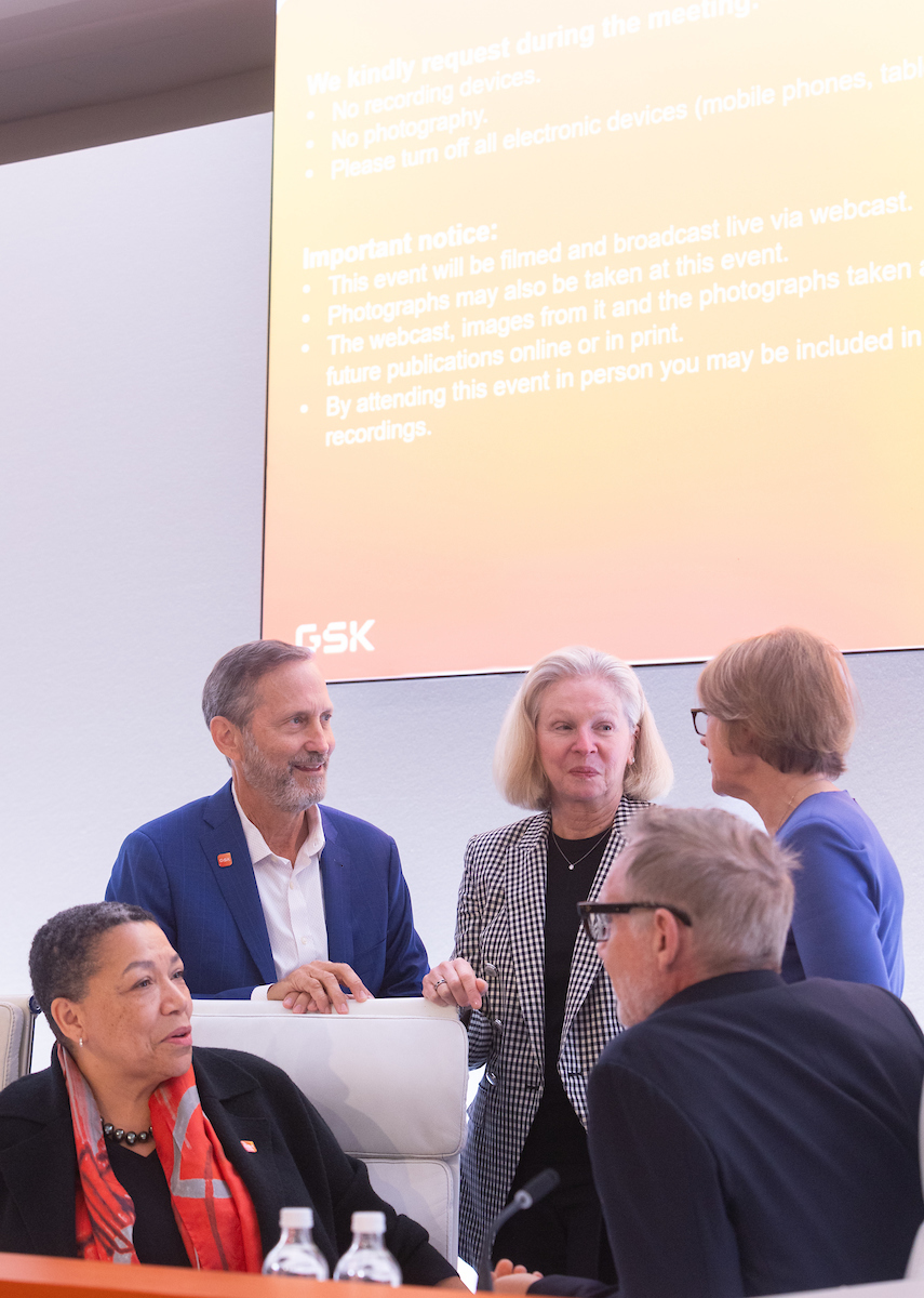 Group of four Board of Directors, men and women in discussion with CFO Julie Brown