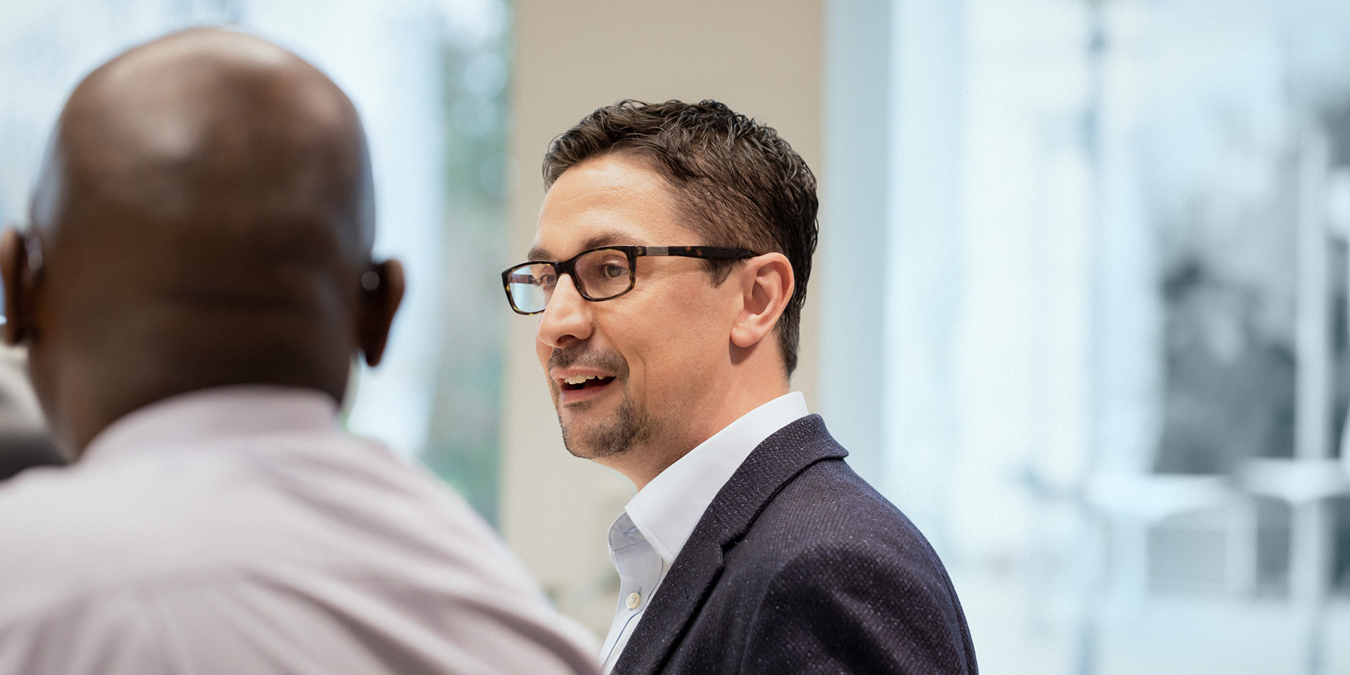 Two men talking joyfully