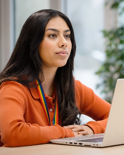Woman listening intently to another employee