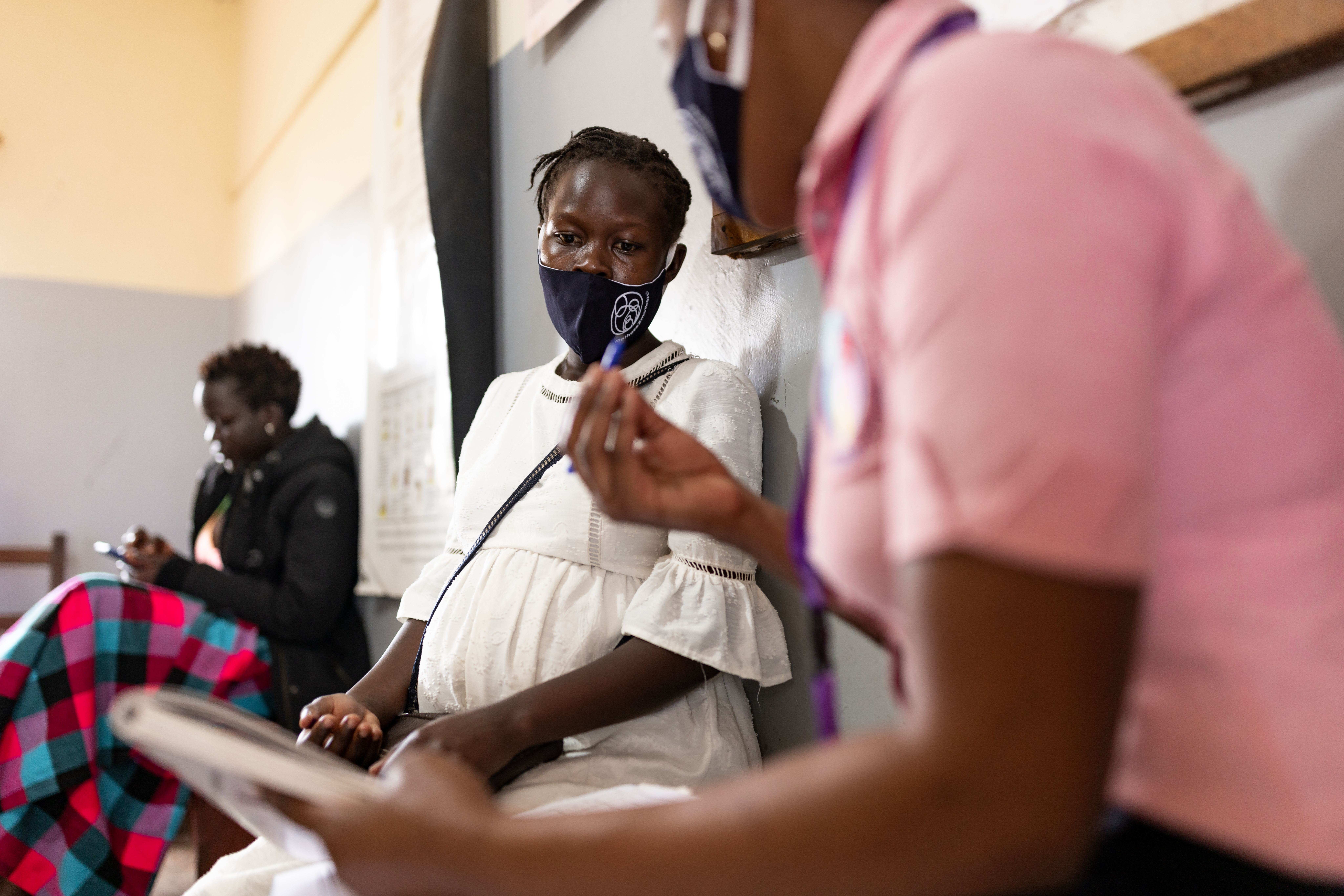 Pregnant woman talking to doctor