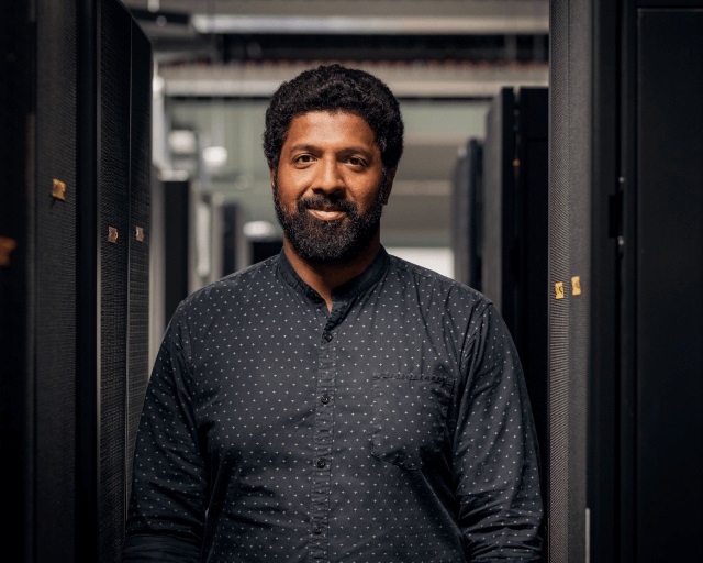 man standing and facing the camera