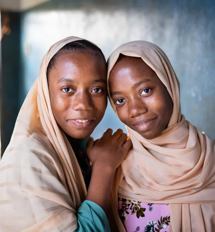 Twin sisters from Zanzibar looking at camera