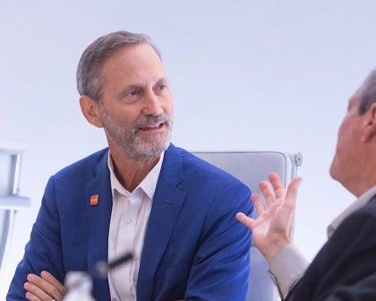 GSK Senior Independent Director, Charles Bancroft, listens as man sitting next to him speaks