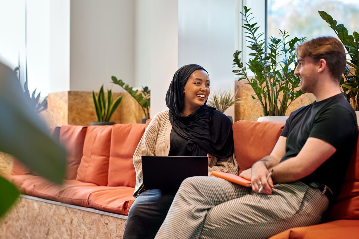 Two employees talking in GSK House