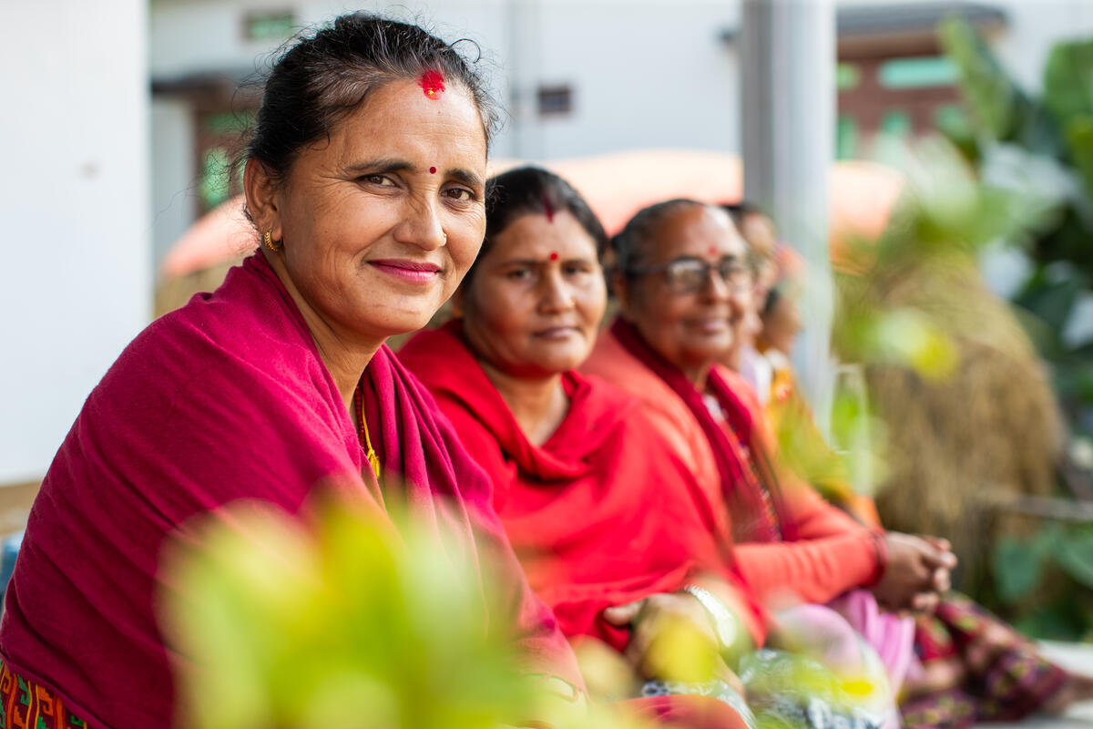 Nepali women dressed in crimson red dresses