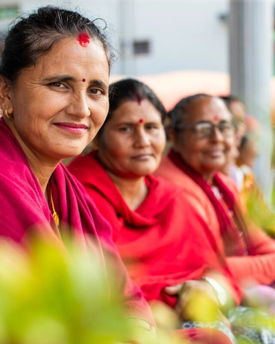 Nepali women dressed in crimson red dresses