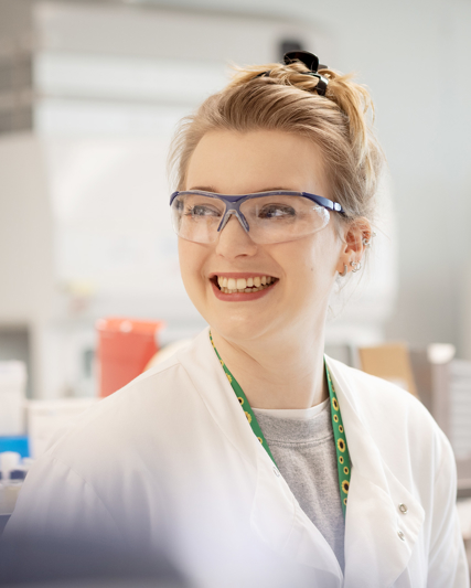 Lab worker smiling