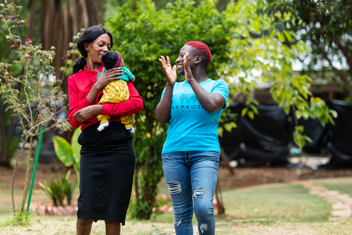two women with a baby