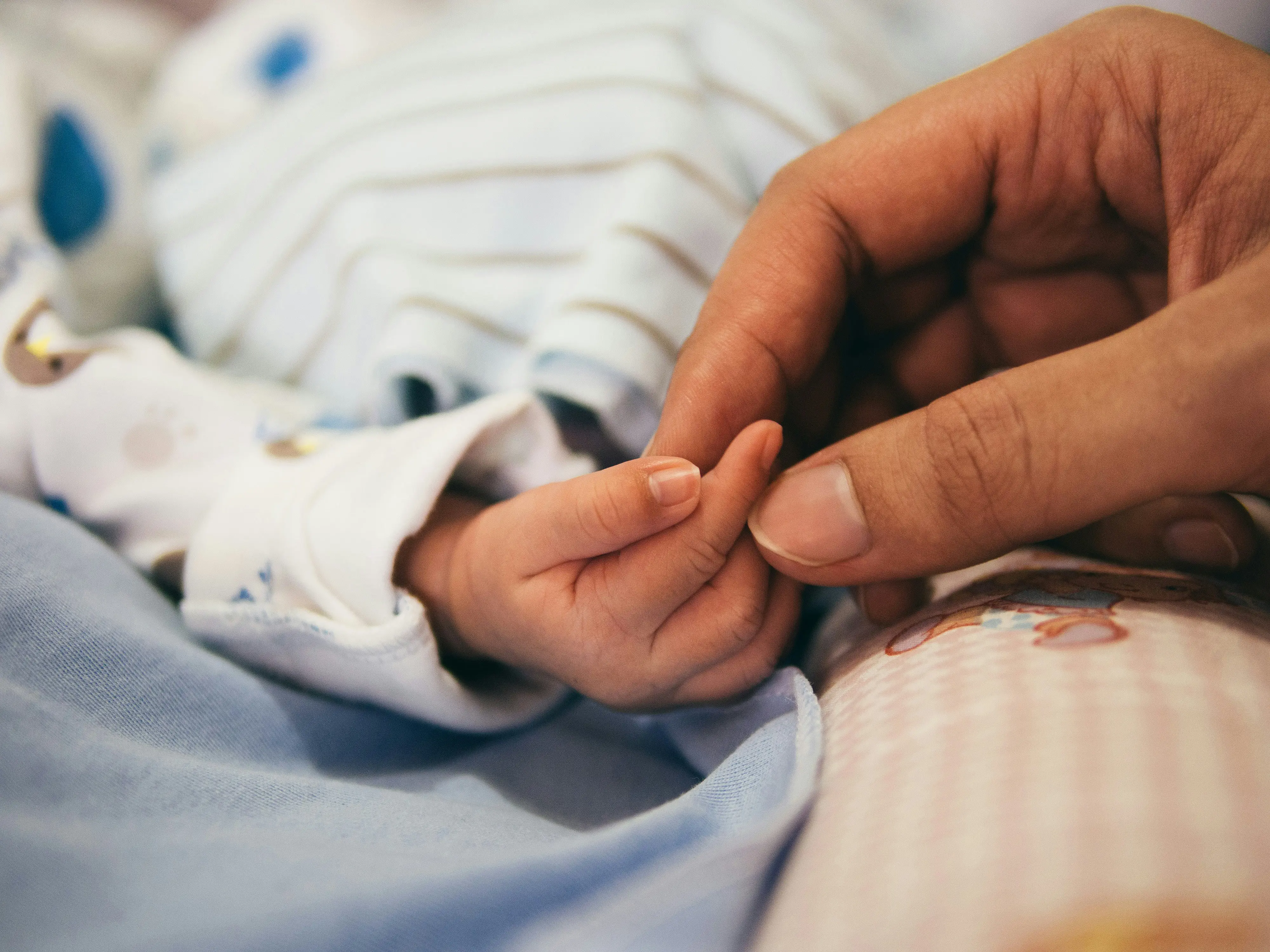 baby and mother hands