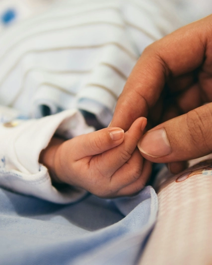 baby and mother hands