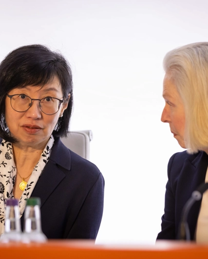 GSK Board members Jeannie Lee and Liz McKee Anderson speak to each other