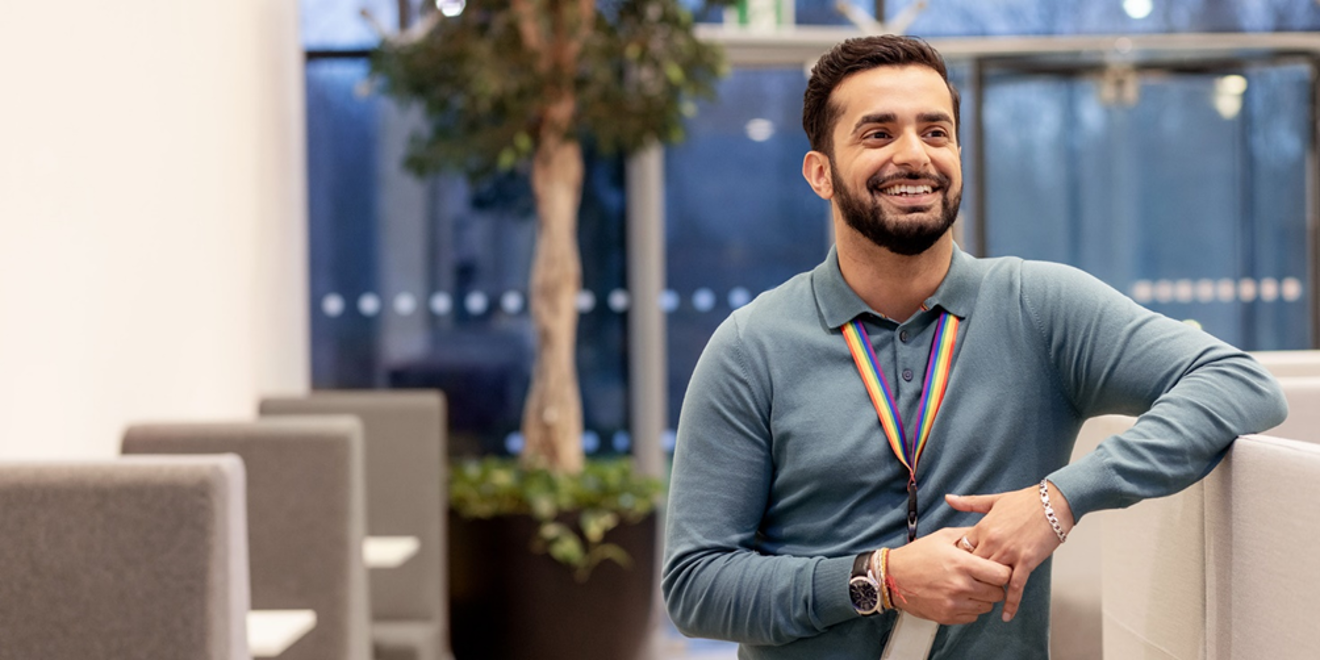 Man smiling in an office