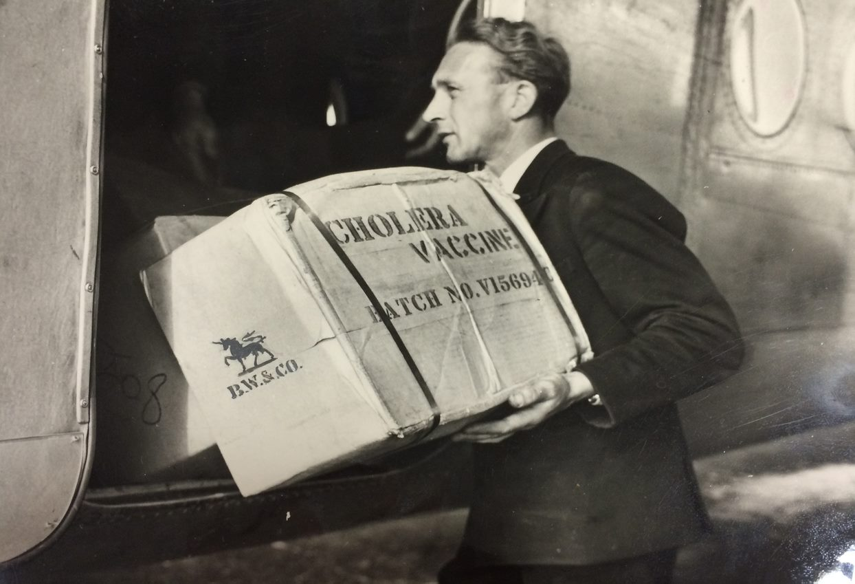 Cholera vaccines being loaded onto a plane during the 1947 epidemic