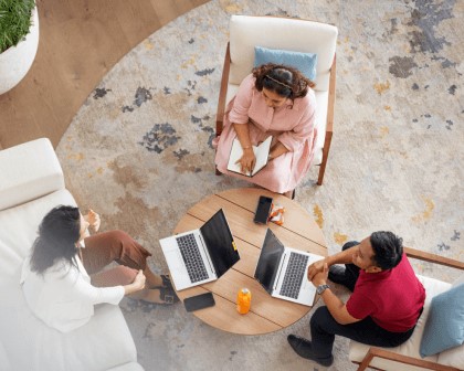 three coworkers around a table