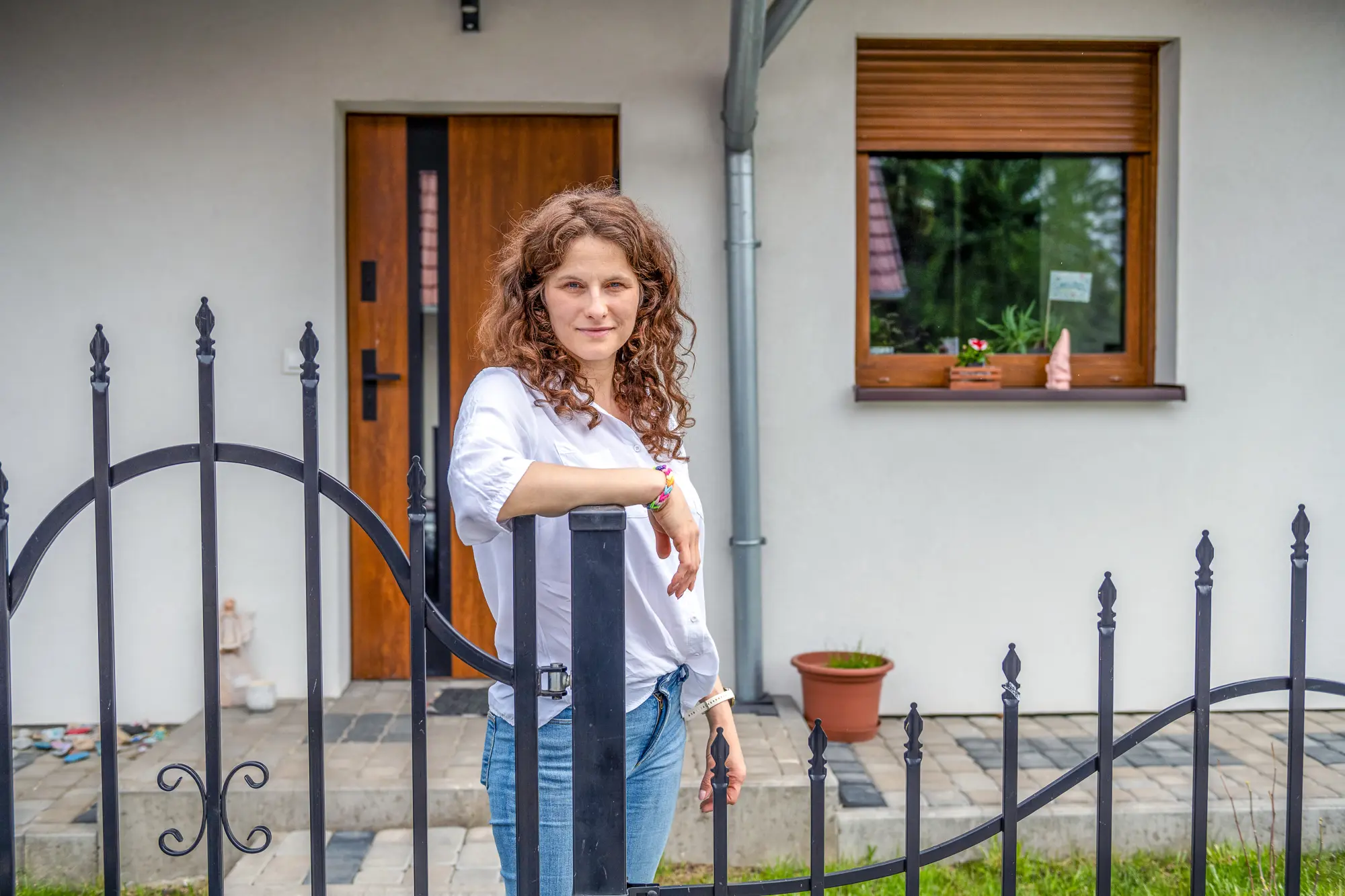Natalia standing by gate