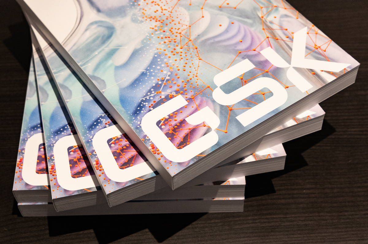 Stack of Annual Reports with GSK written in white on cover