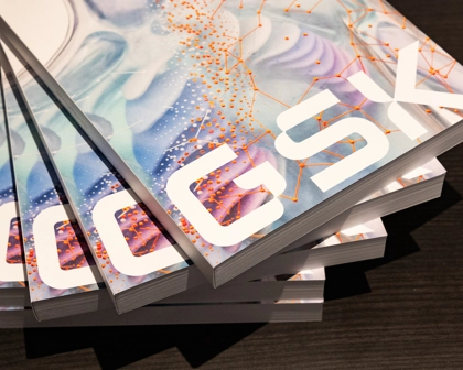 Stack of Annual Reports with GSK written in white on cover