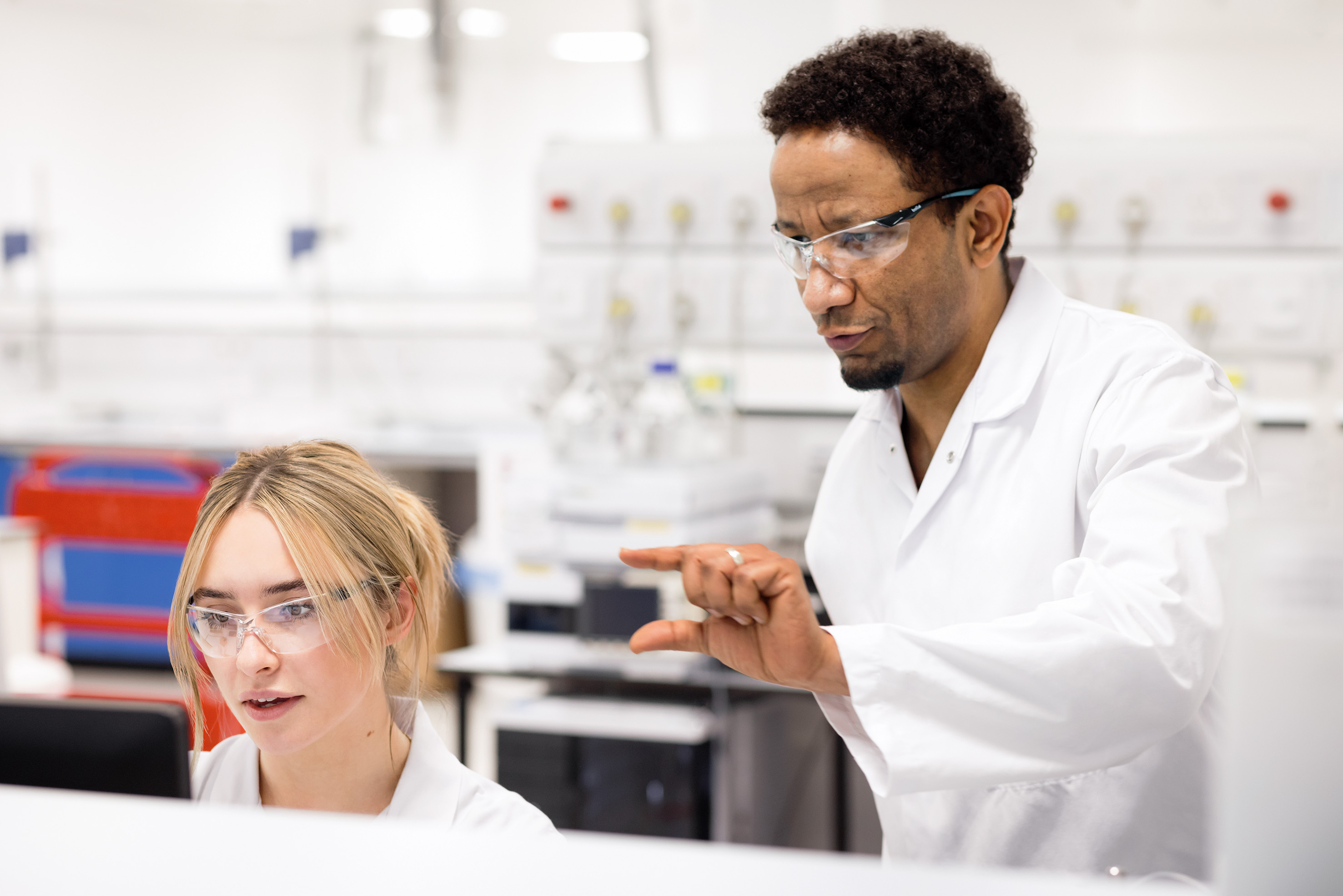 Lab workers collaborating