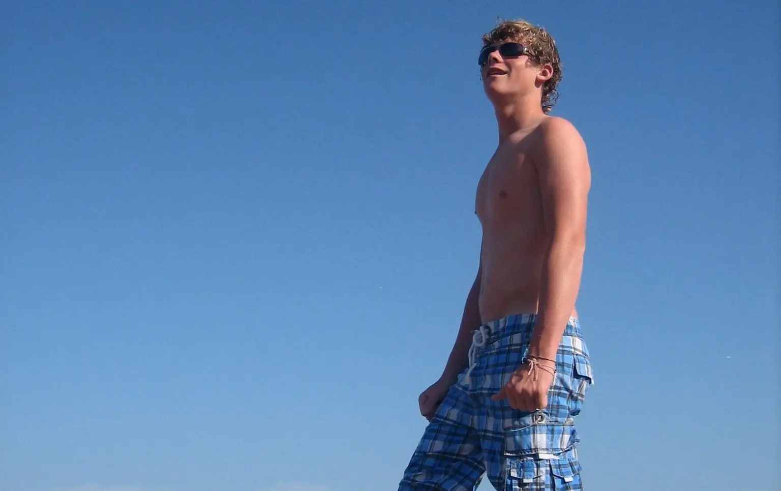 Photograph of Ryan on holiday by the sea in Majora six months before he died of IMD