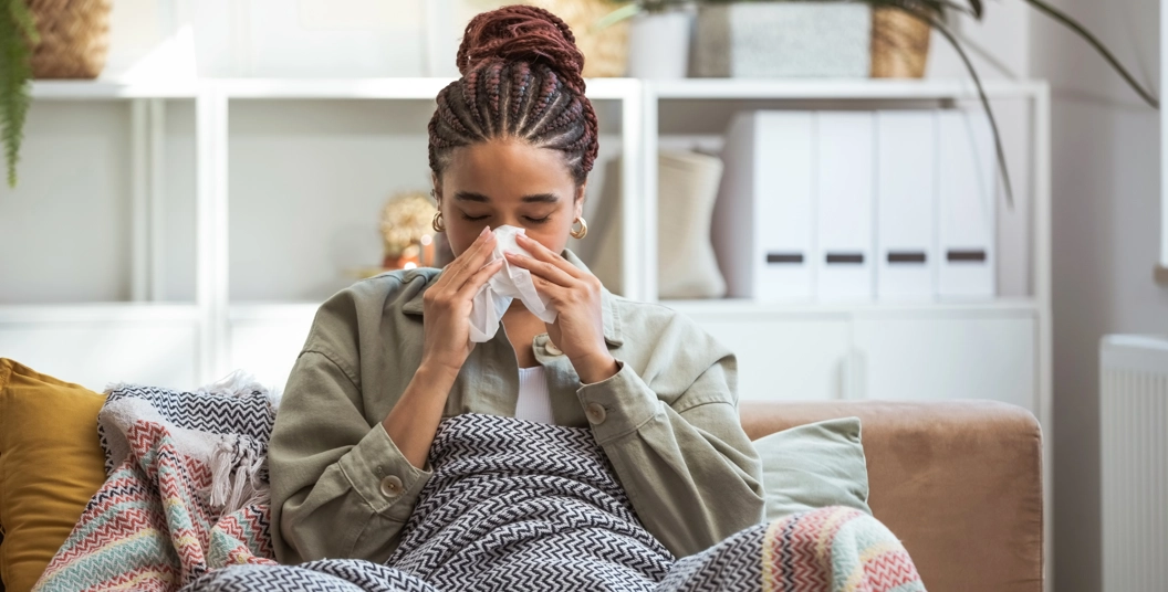 woman sneezing